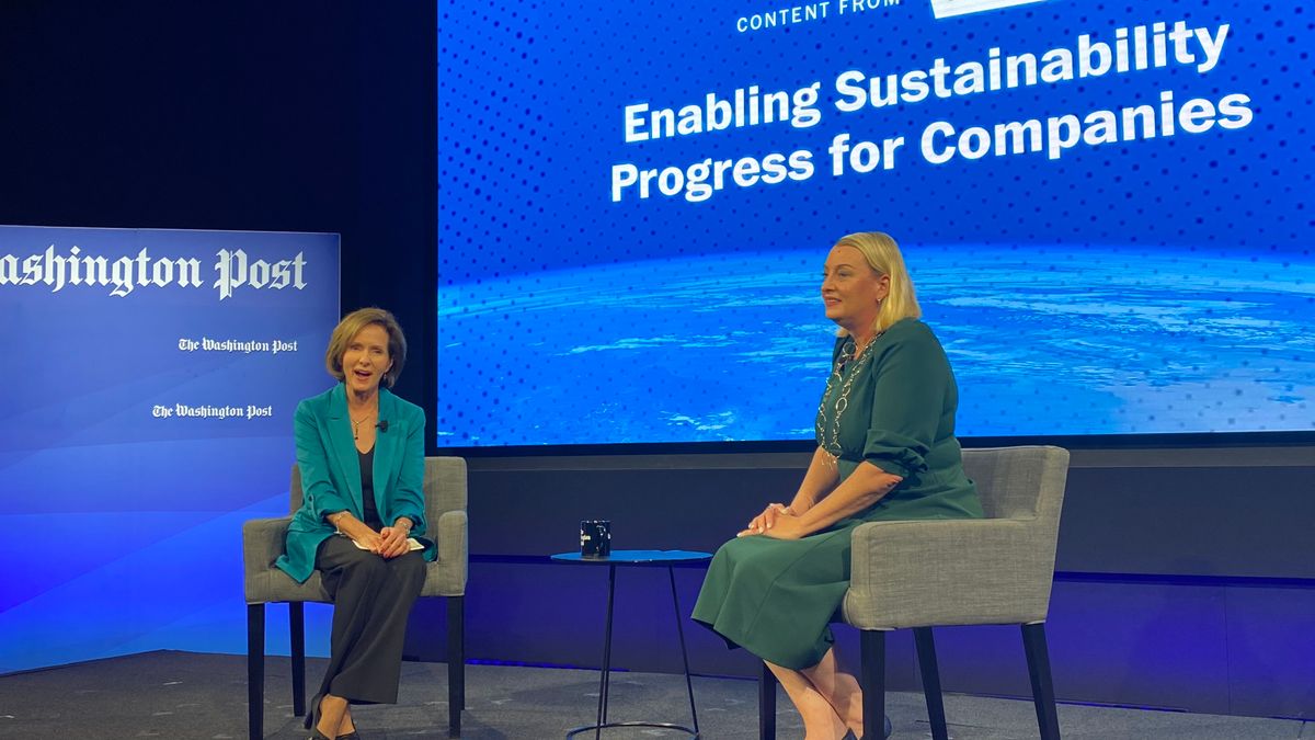 Kathleen Koch and Tara Hemmer sit on a stage with a screen describing the Washington Post speaking event behind them